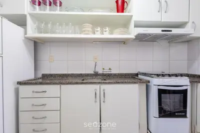 A cozinha ou kitchenette de Aptos em Condo Beira-Mar em Itapema - DNL