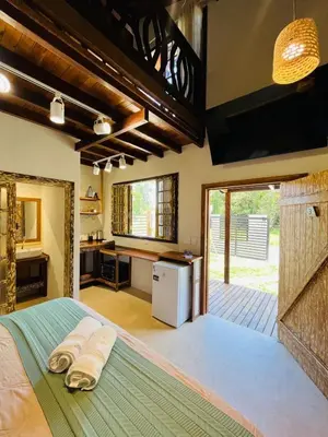 Uma cama ou camas num quarto em Cabana na Natureza Com Hidro - Baoba Suites
