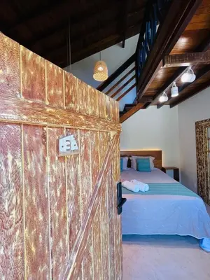 Uma cama ou camas num quarto em Cabana na Natureza Com Hidro - Baoba Suites