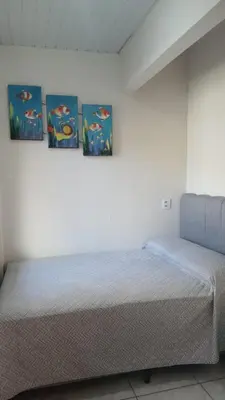 Uma cama ou camas num quarto em Casa Completa litoral SC com 4 qtos com ar condicionado e Aceita Pets