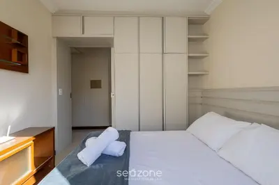 Uma cama ou camas num quarto em Apto c/ varanda gourmet à beira-mar RKR0502