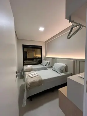 Uma cama ou camas num quarto em Apartamento Praia de Palmas Governador Celso Ramos SC - 300mts do mar