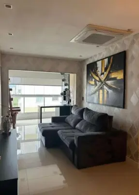 Uma área de estar em Apartamento proximo ao mar no melhor da Meia Praia