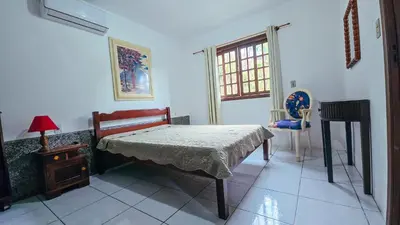 Uma cama ou camas num quarto em Sobrado da Salete Térreo