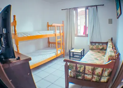 Uma cama ou camas num quarto em Sobrado da Salete Térreo