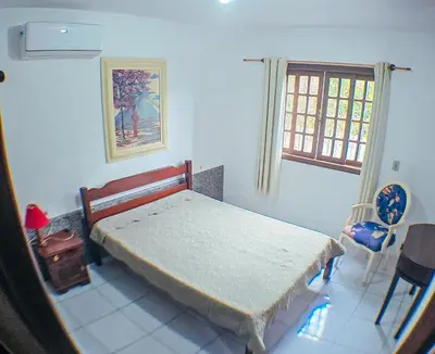Uma cama ou camas num quarto em Sobrado da Salete Térreo