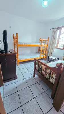 Uma cama ou camas num quarto em Sobrado da Salete Térreo