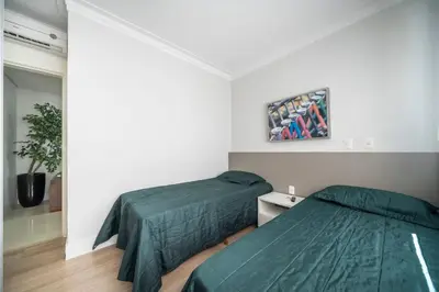 Uma cama ou camas num quarto em Varandas do Atlântico 203A – Frente Mar em Bombas