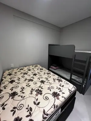 Uma cama ou camas num quarto em Apartamento 2 quartos pertinho do mar
