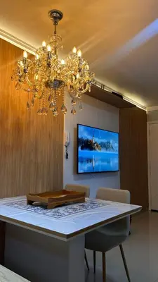 Uma televisão e/ou sistema de entretenimento em Lindo apartamento em Balneário Camboriú próximo as praias