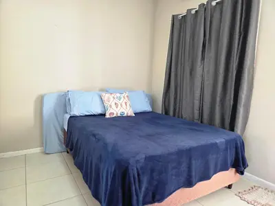 Uma cama ou camas num quarto em Refugio Bombinhas - Residencial Maria Olga