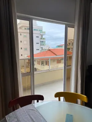 Uma cama ou camas num quarto em Amplo e aconchegante apartamento a 4 min do mar