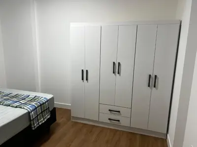 Uma cama ou camas num quarto em Apartamento novo e exclusivo no Austin 179 em Itapema