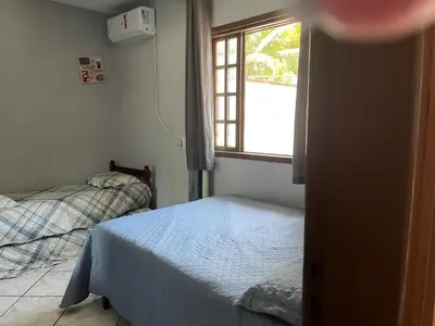 Uma cama ou camas num quarto em casa morada da praia