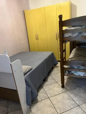 Uma cama ou camas num quarto em casa morada da praia