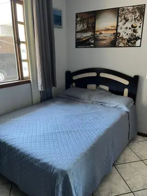 Uma cama ou camas num quarto em casa morada da praia