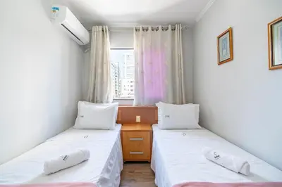 Uma cama ou camas num quarto em Achei Itapema • João Caetano Residencial, R.280