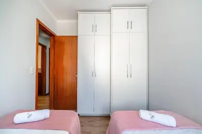 Uma cama ou camas num quarto em Achei Itapema • João Caetano Residencial, R.280