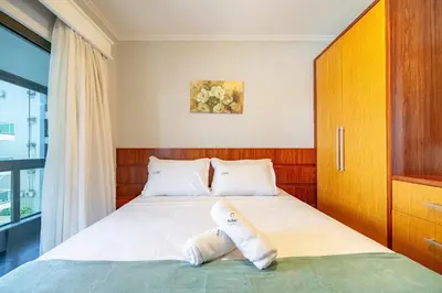 Uma cama ou camas num quarto em Achei Itapema • João Caetano Residencial, R.280
