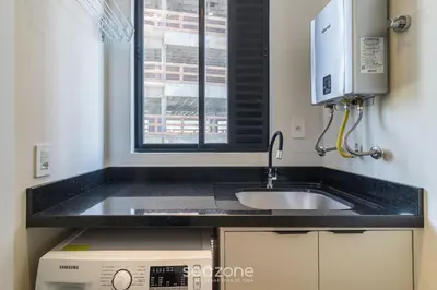 A cozinha ou kitchenette de Aptos completos a poucos passos do mar em Perequê MTRs