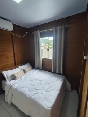 Uma cama ou camas num quarto em Studios Jardim