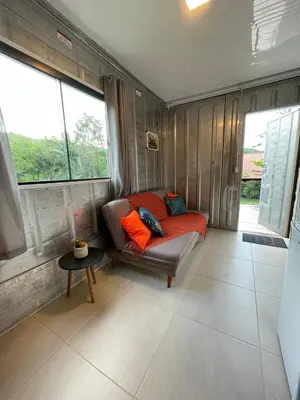 Uma área de estar em Estudio Praia do Estaleiro - Balneário Camboriú