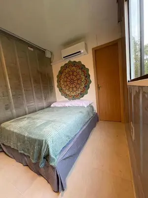 Uma cama ou camas num quarto em Estudio Praia do Estaleiro - Balneário Camboriú