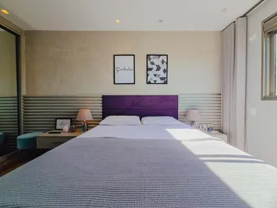Uma cama ou camas num quarto em Apartamento Para Locação No Centro de Bombinhas