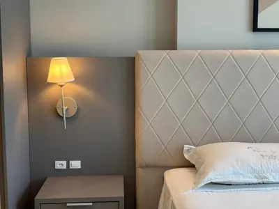 Uma cama ou camas num quarto em Vista Mar - Suíte, Cozinha Completa, Até 4 pessoas
