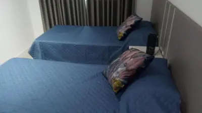 Uma cama ou camas num quarto em Apartamento Eco Village Park