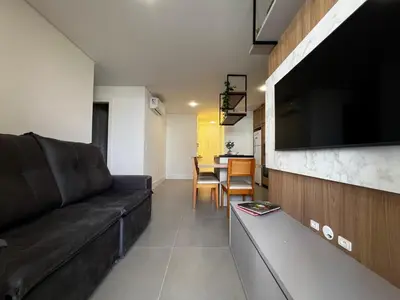 Uma área de estar em Apartamento com área de lazer completo à 100 metros da praia de Mariscal - Bombinhas