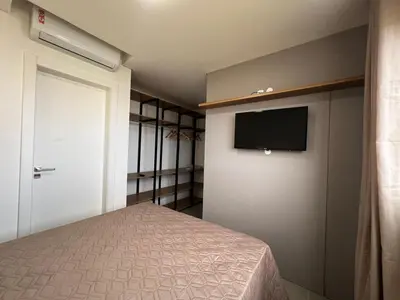 Uma cama ou camas num quarto em Apartamento com área de lazer completo à 100 metros da praia de Mariscal - Bombinhas