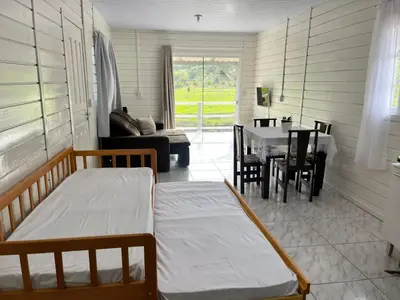 Uma cama ou camas num quarto em Casa de temporada em Bombinhas - SC