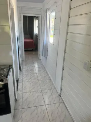 Uma cama ou camas num quarto em Casa de temporada em Bombinhas - SC