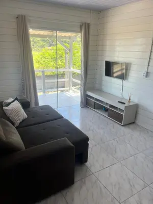 Uma televisão e/ou sistema de entretenimento em Casa de temporada em Bombinhas - SC