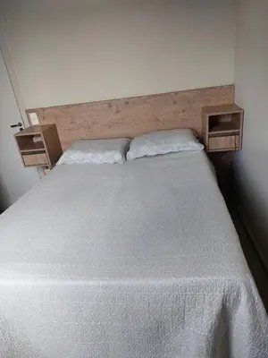 Uma cama ou camas num quarto em Apartamento para Férias