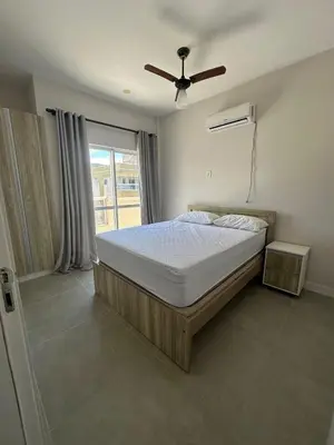 Uma cama ou camas num quarto em Cobertura em Bombas