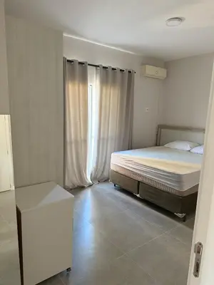 Uma cama ou camas num quarto em Cobertura em Bombas