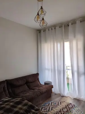 Uma área de estar em Apartamento em Bombas