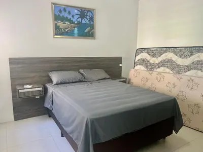 Uma cama ou camas num quarto em Lindo! Apto com piscina no condomínio - EF01J
