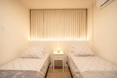 Uma cama ou camas num quarto em Cobertura | 03 suítes | vista mar