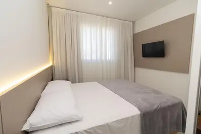 Uma cama ou camas num quarto em Farol de Bombas
