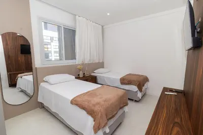 Uma cama ou camas num quarto em Farol de Bombas