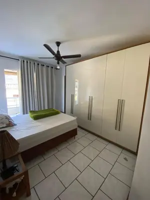 Uma cama ou camas num quarto em Apartamento próximo ao mar