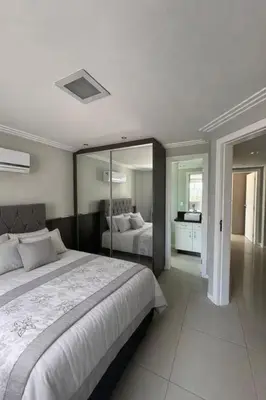 Uma cama ou camas num quarto em Apartamento com 3 quartos no Centro em Balneário Camboriú
