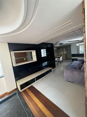 Uma televisão e/ou sistema de entretenimento em Apartamento com 3 quartos no Centro em Balneário Camboriú