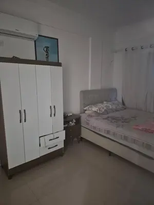 Uma cama ou camas num quarto em Apartamento final do ano