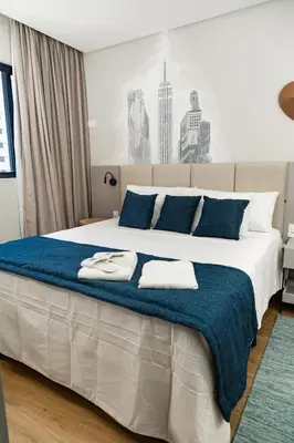 Uma cama ou camas num quarto em Flat 906 - 200m da Praia, Restaurantes e Hard Rock Café