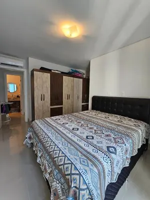 Uma cama ou camas num quarto em Apartamento no centro de Itapema
