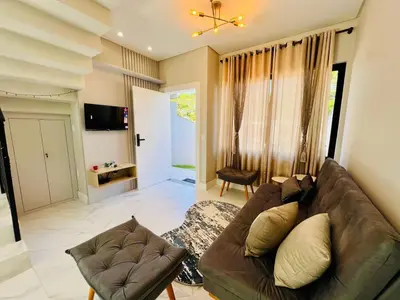Uma televisão e/ou sistema de entretenimento em Kawa Residence - Mariscal